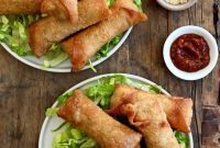 Golden Crispy Pork Egg Rolls with Tangy Ginger Soy