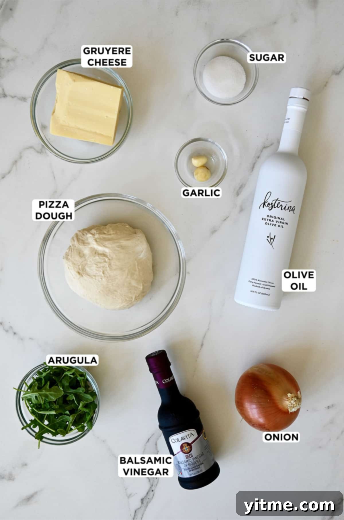 Ingredients for French Onion Pizza: olive oil, balsamic vinegar, onions, gruyere cheese, sugar, garlic, pizza dough, and arugula