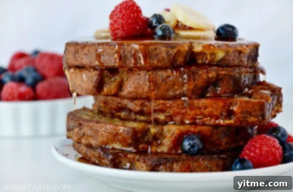 Banana Bread Bliss: A Decadent French Toast Twist 6 Stack of Banana Bread French Toast topped with fresh fruit and pure maple syrup
