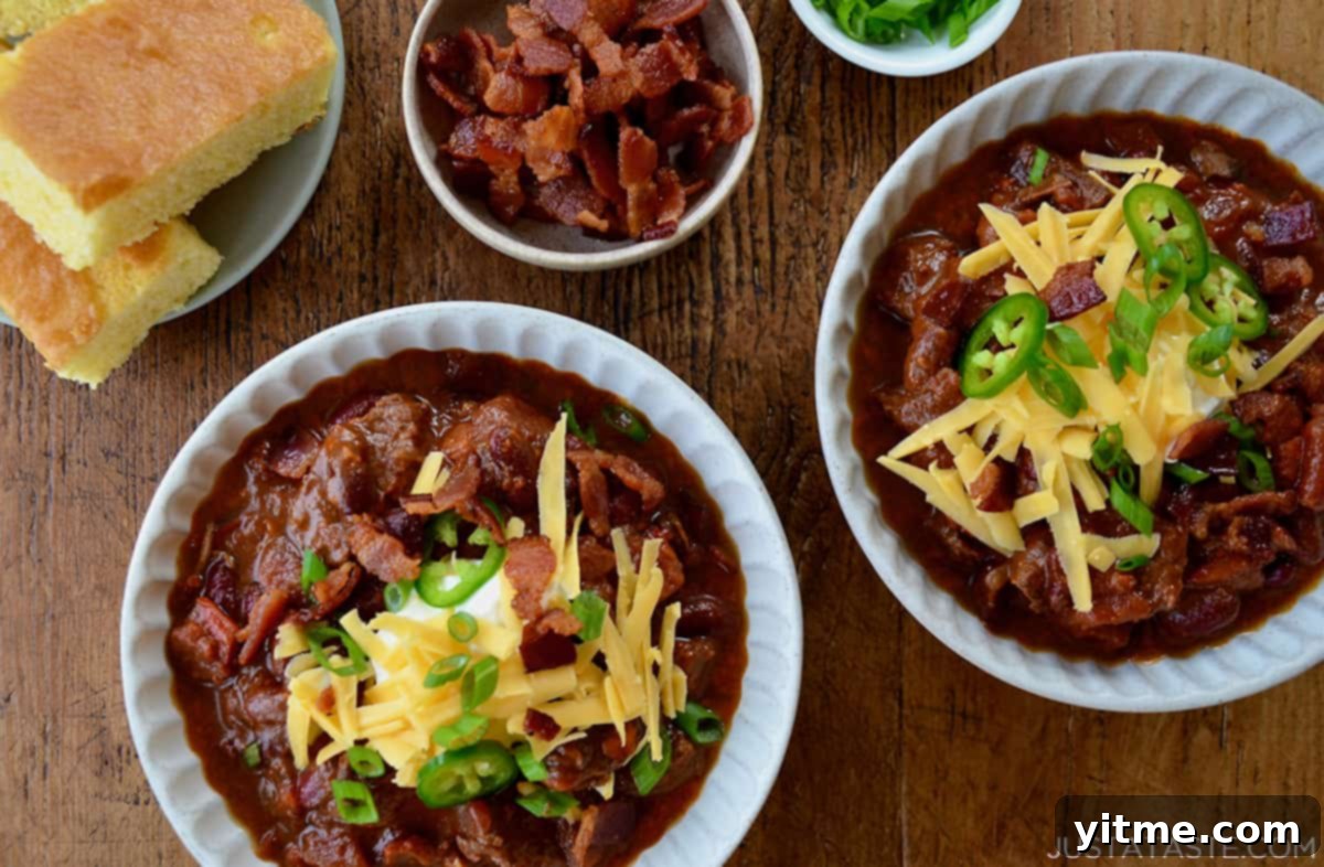 Bowls of chili topped with toppings