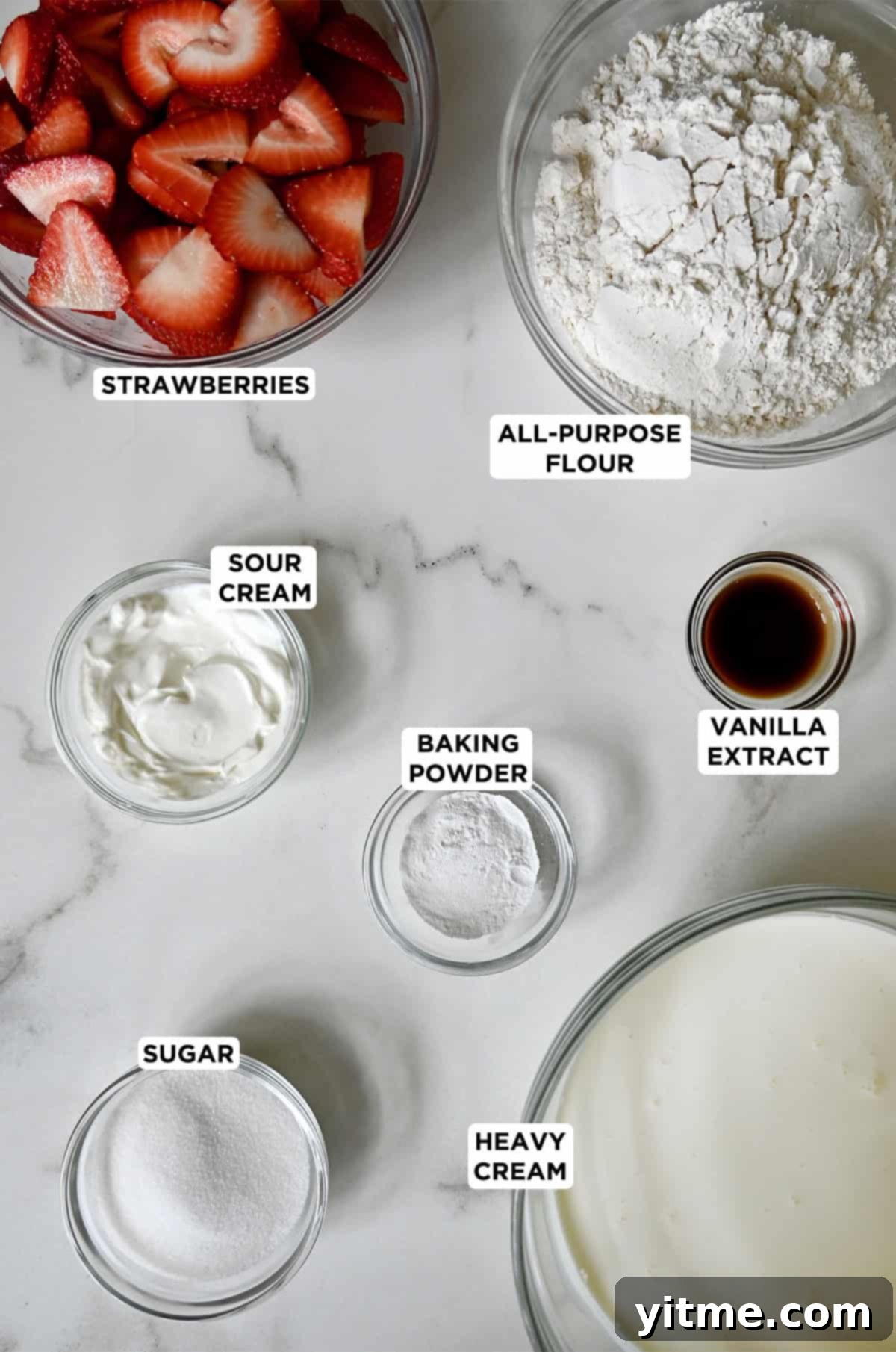 Quick Strawberry Shortcake 3 Various sizes of glass bowls containing ingredients to make strawberry shortcake.