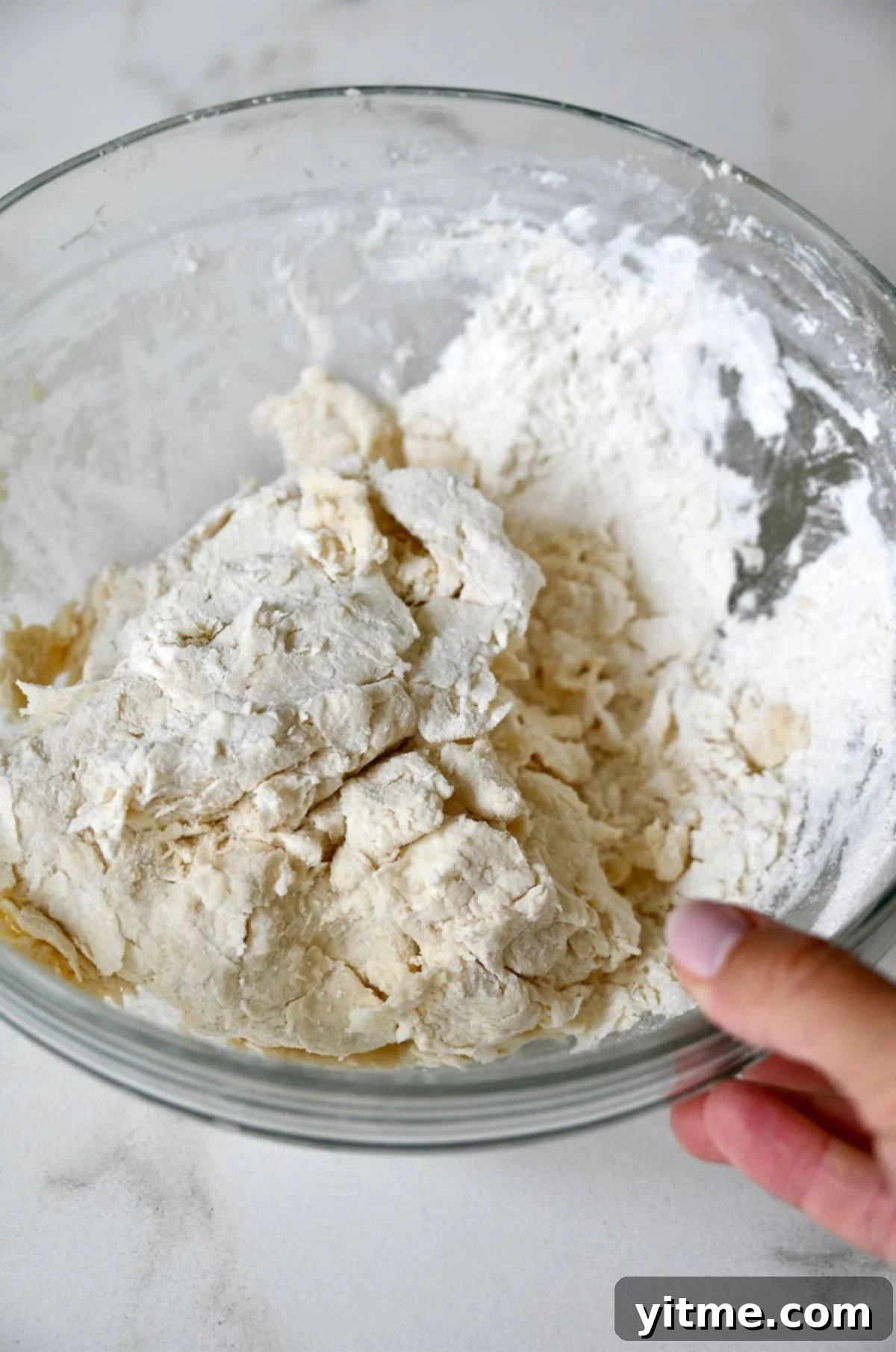 Quick Strawberry Shortcake 5 Shaggy shortcake dough in a glass bowl.