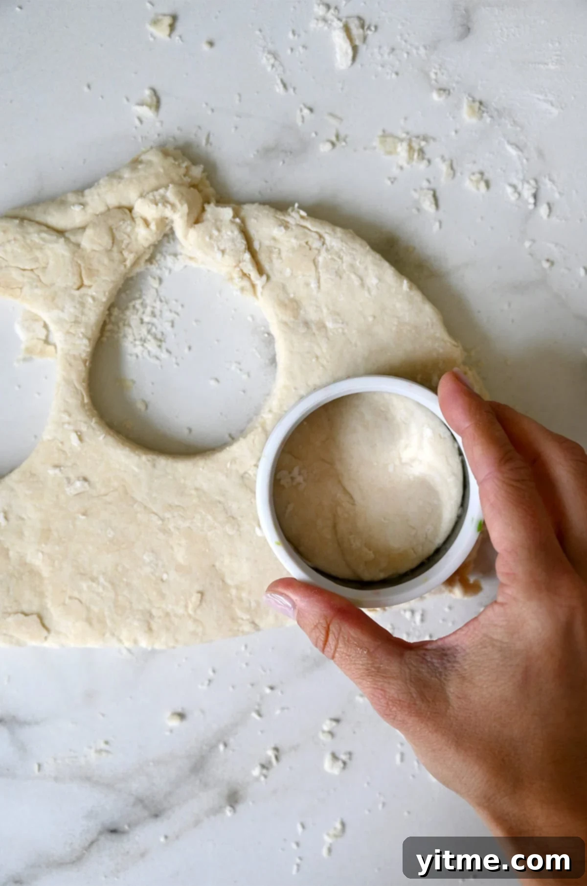 Quick Strawberry Shortcake 7 Punching out shortcake dough with a round biscuit cutter.