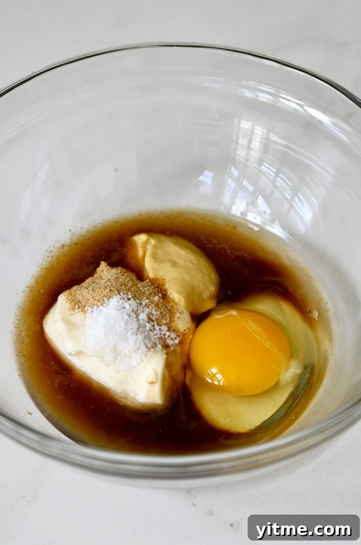 The flavorful base of crab cakes: Worcestershire sauce, Dijon mustard, mayo, an egg, and salt.