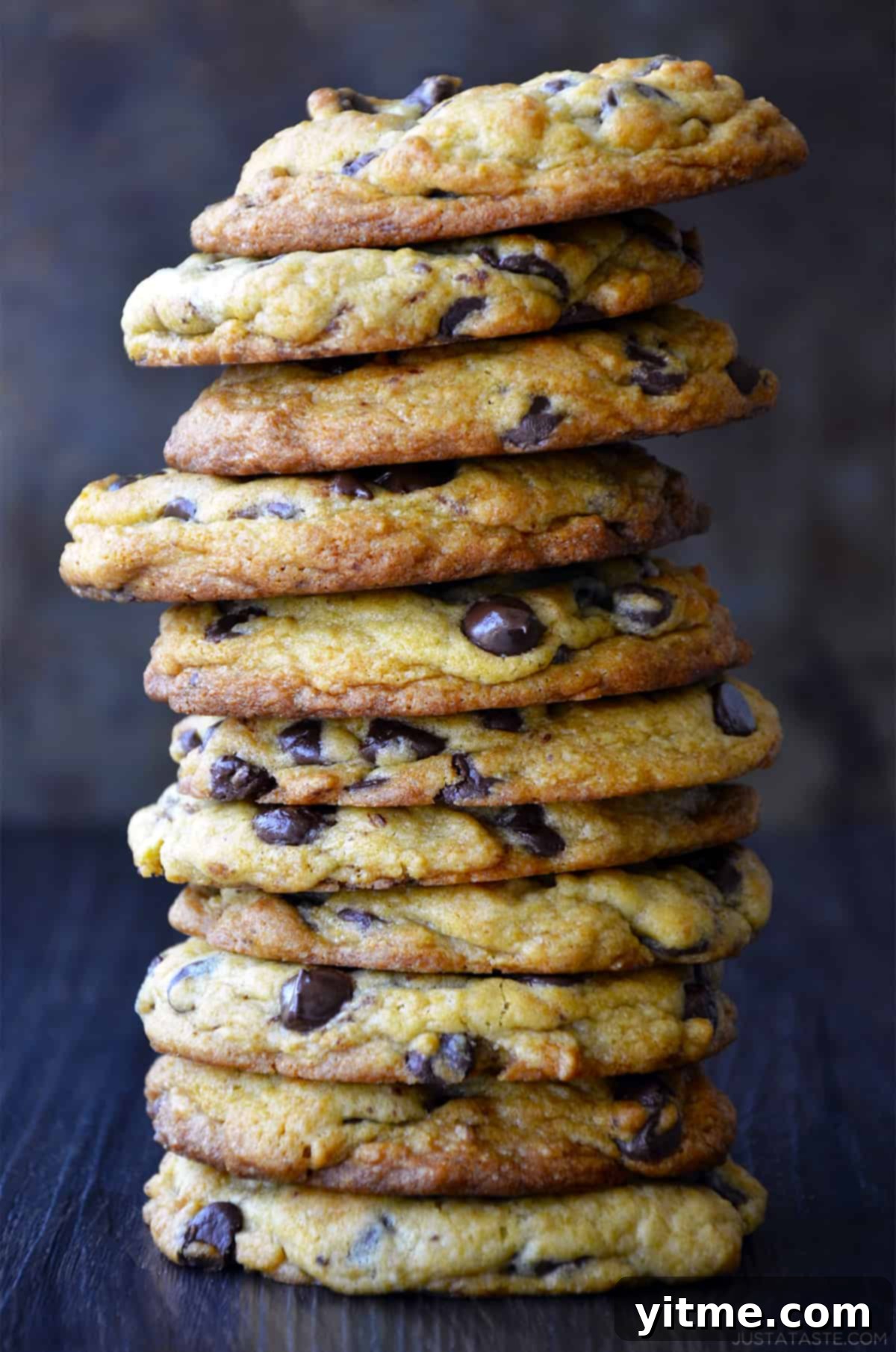 A tall stack of Secret Ingredient Chocolate Chip Cookies made with cream cheese.