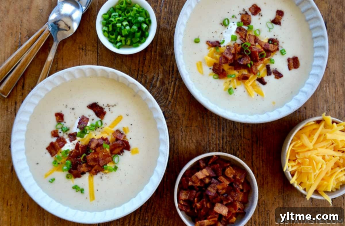 Creamy Potato Soup with Crispy Bacon and Cheddar 12 Two bowls of loaded baked potato soup.