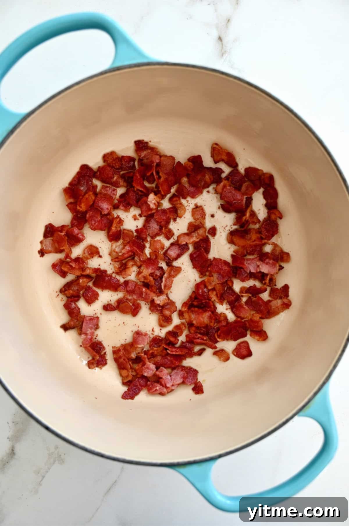 Creamy Potato Soup with Crispy Bacon and Cheddar 4 Crispy cooked bacon in a Dutch oven.