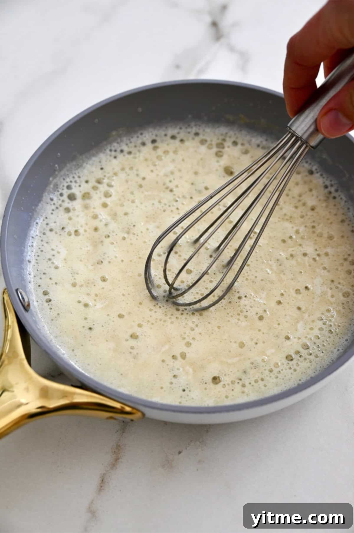 Creamy Potato Soup with Crispy Bacon and Cheddar 7 Making a roux with butter and flour.
