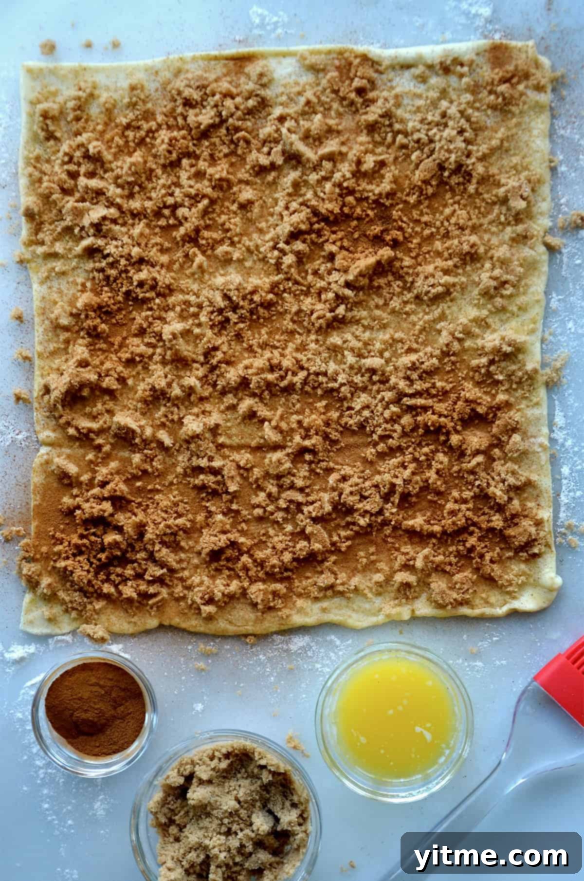 Puff pastry topped with butter, sugar, and cinnamon.