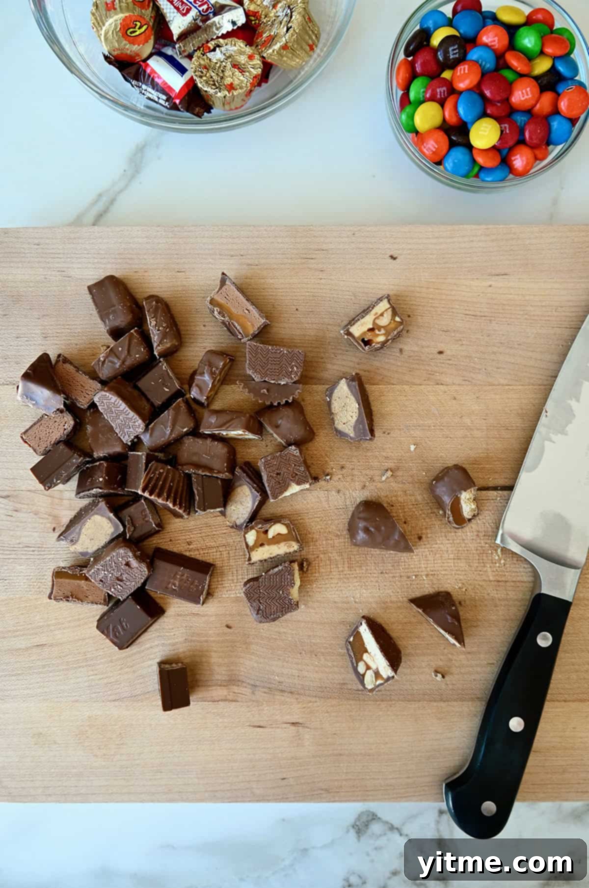 Chopped candy bars on a cutting board.