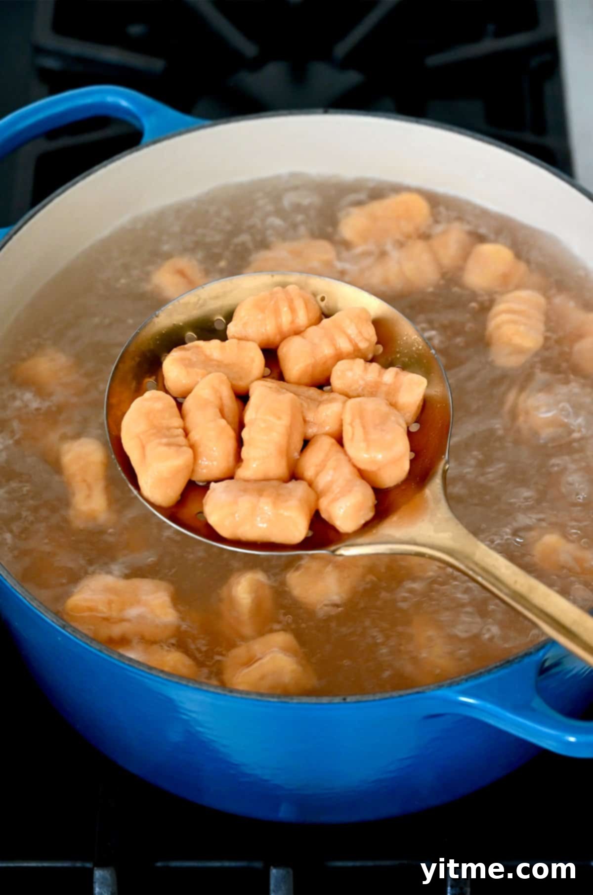 Sweet Potato Gnocchi in Balsamic Brown Butter Sauce 11 Cooking sweet potato gnocchi in a pot of boiling water.