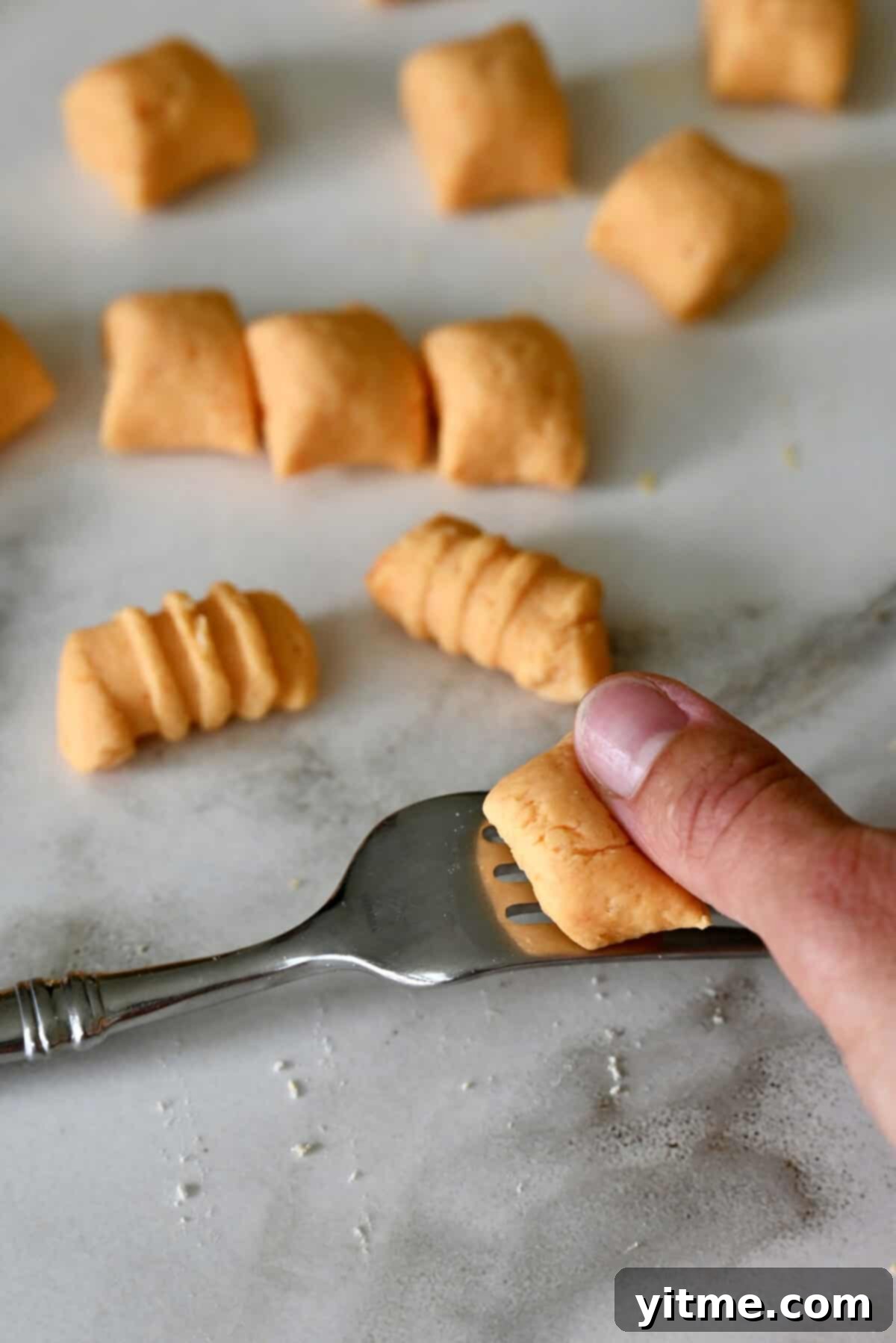 Sweet Potato Gnocchi in Balsamic Brown Butter Sauce 8 Rolling gnocchi dough on a fork to create that classic gnocchi shape.