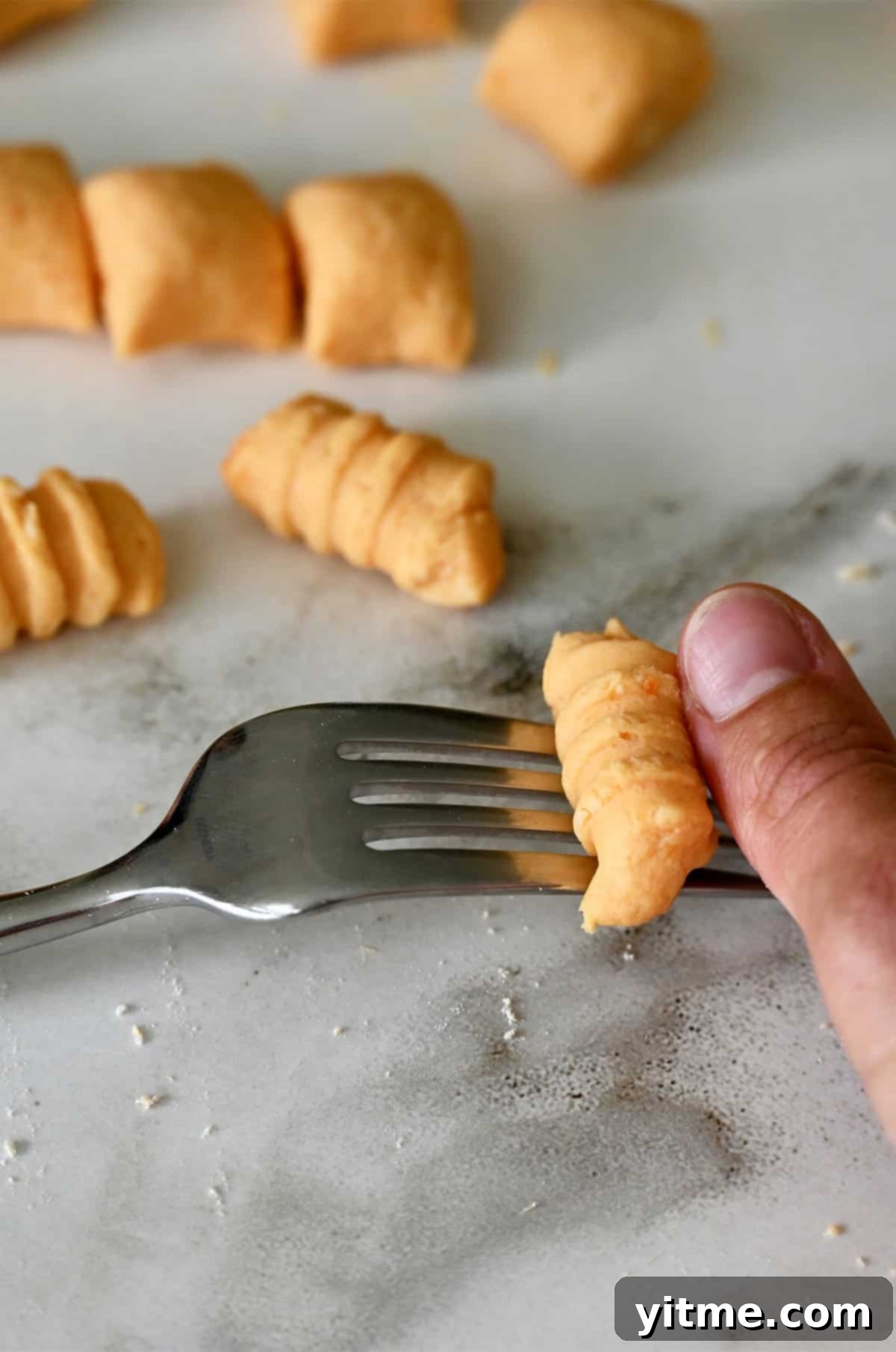 Sweet Potato Gnocchi in Balsamic Brown Butter Sauce 9 Rolling gnocchi on a fork to create those classic ridges.