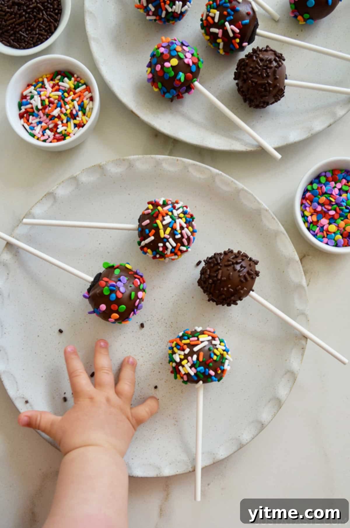 Chocolate Cookie Pops: The Easiest Dessert Ever 7 A child reaching for a chocolate cookie pop