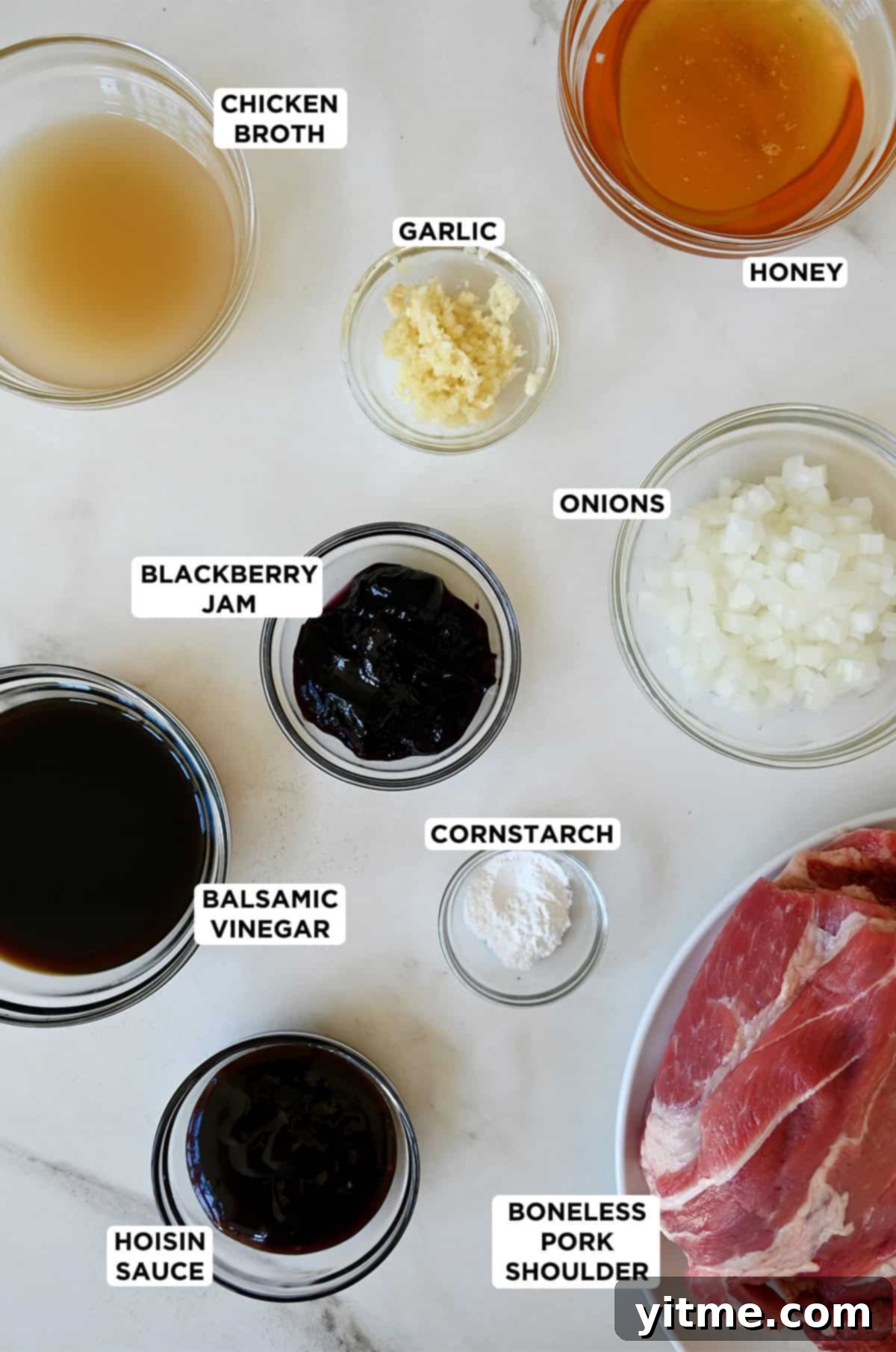 Balsamic Honey Pulled Pork: A Slow Cooker Delight 3 Pulled pork ingredients, including pork shoulder, honey, balsamic vinegar, cornstarch, diced onions, minced garlic, blackberry jam and hoisin sauce.