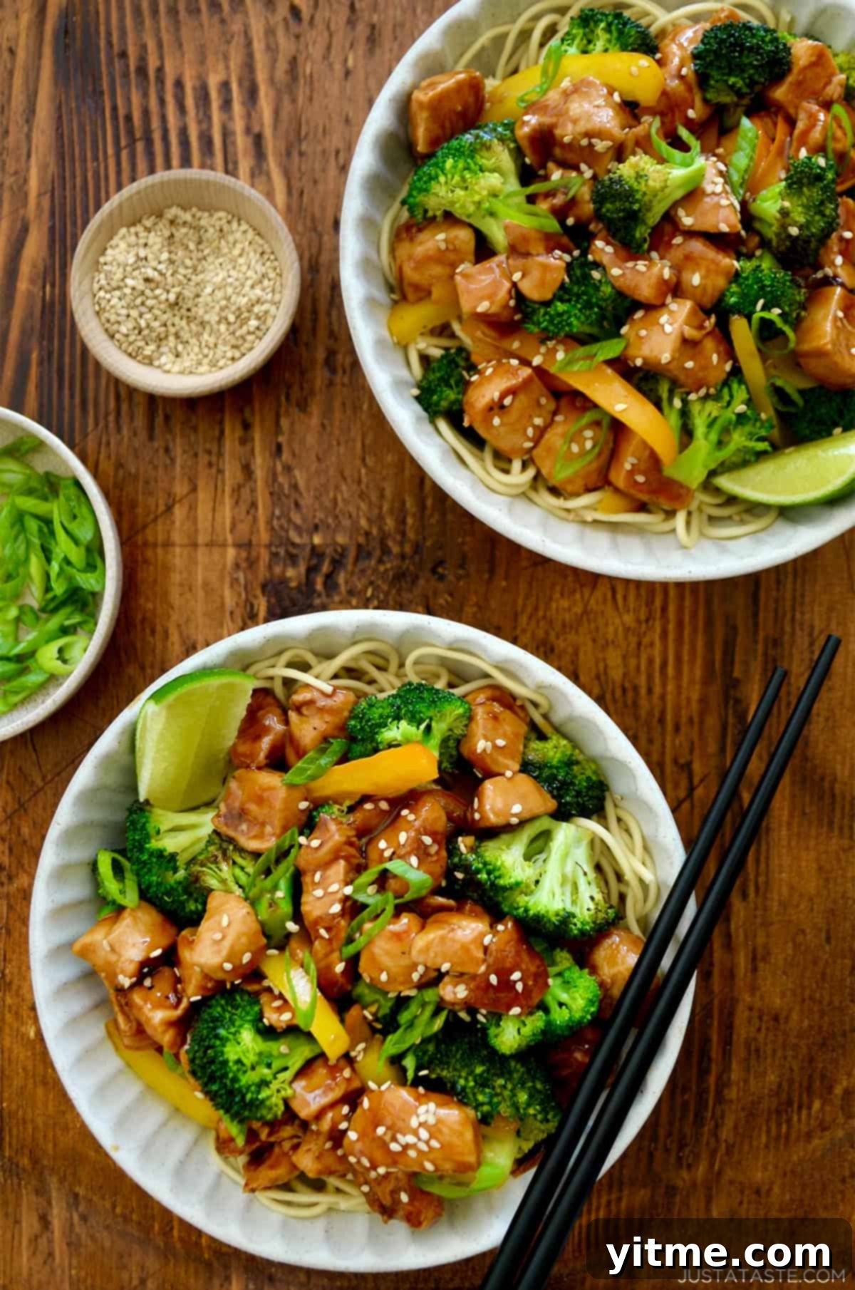 Chicken and broccoli stir-fry served over noodles.