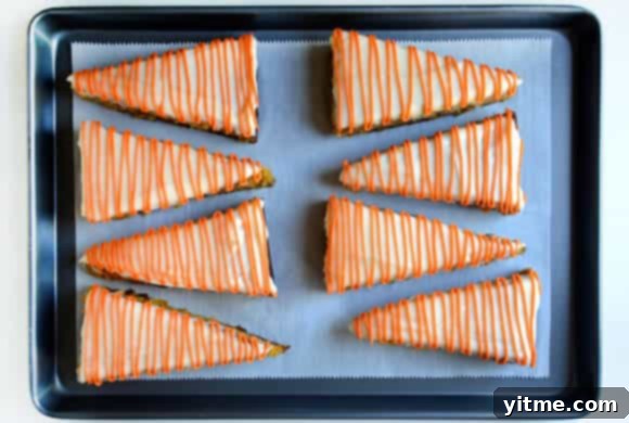 Pineapple Carrot Cake with Cream Cheese Frosting #recipe Frosted Pineapple Carrot Cake with carrot stems inserted