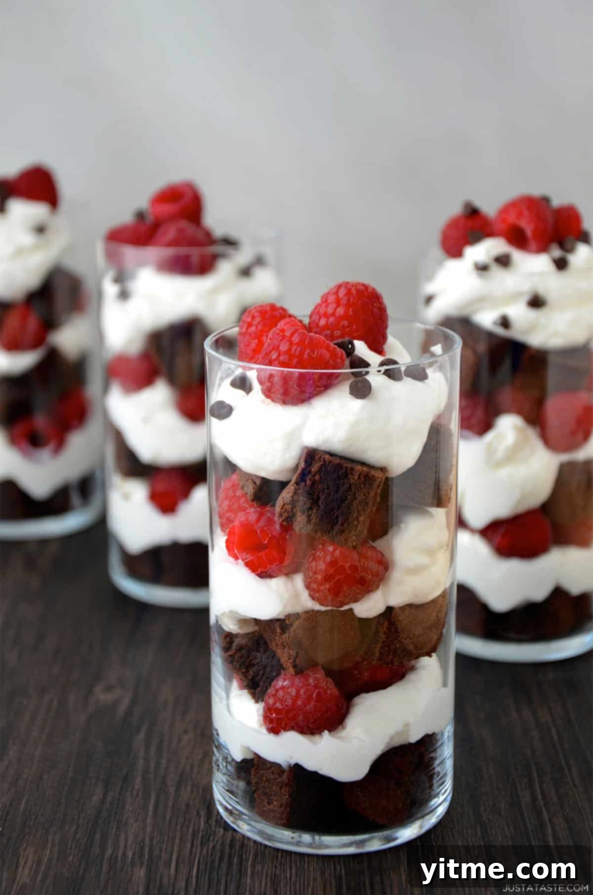 Individual Fruit and Brownie Parfaits 10 A dessert cup with layers of brownie chunks, whipped cream and fresh raspberries topped with mini chocolate chips.