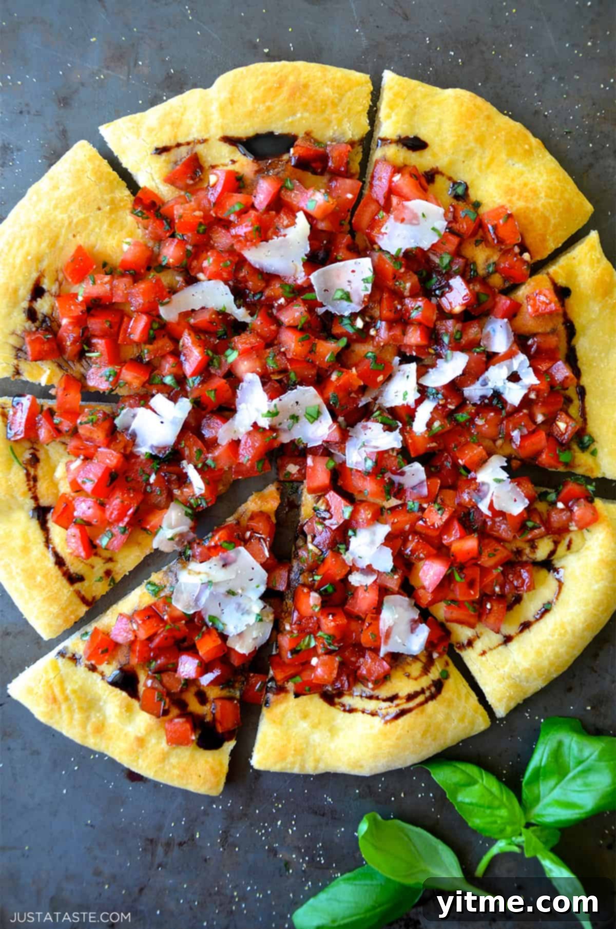 Bruschetta pizza with balsamic syrup and shaved Parmesan cheese.