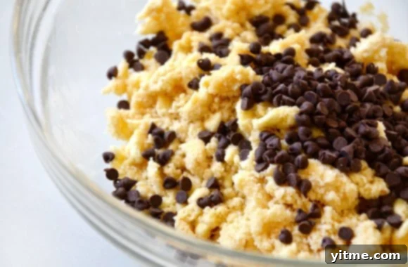 Clear bowl with chocolate chips and shortbread mixture