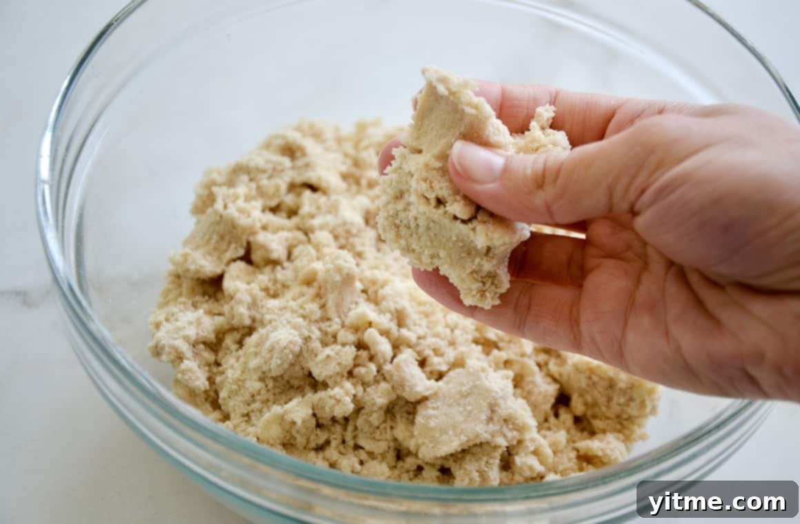 A glass bowl containing shortbread dough