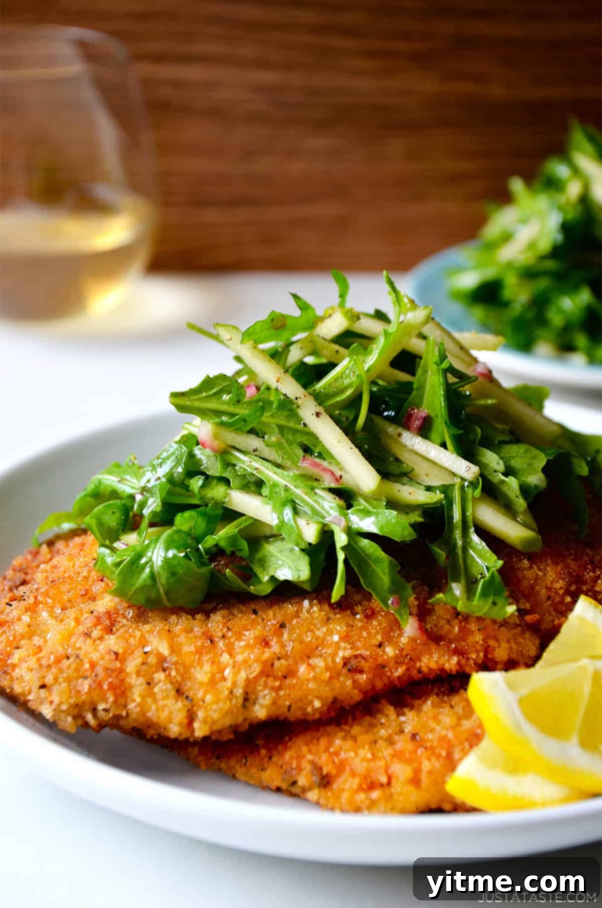 Chicken Milanese with crispy breaded chicken cutlets and arugula salad