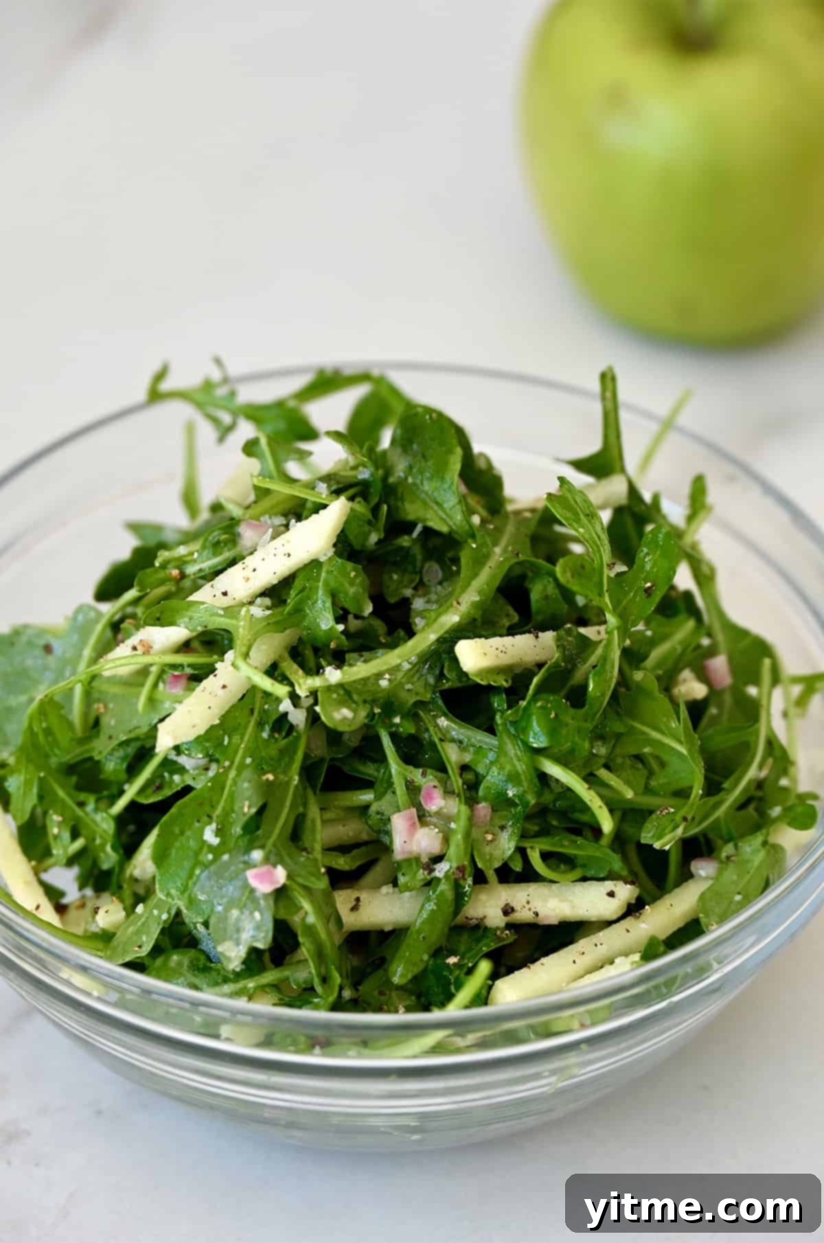 Arugula salad with green apple slices and Dijon vinaigrette