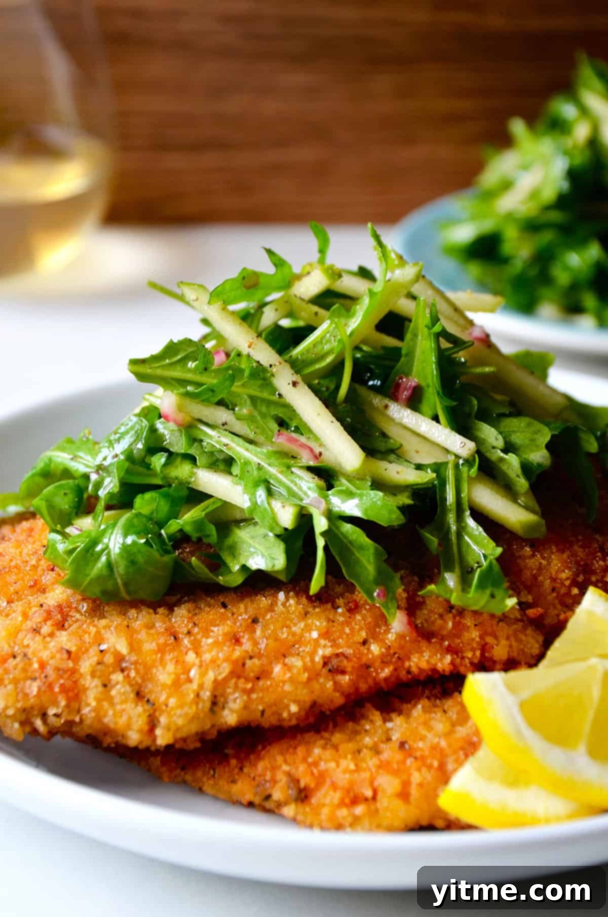 Chicken Milanese topped with arugula salad