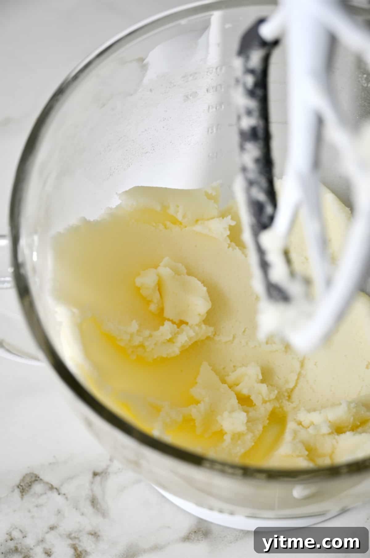 Creamed butter and sugar in the bowl of a stand mixer with the paddle attachment.