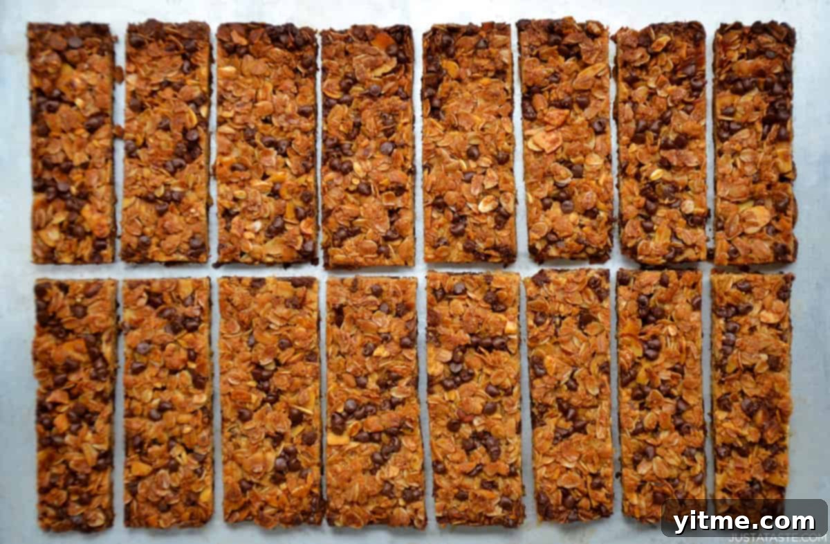 Homemade baked granola bars with mini chocolate chips, neatly arranged and ready to be enjoyed.