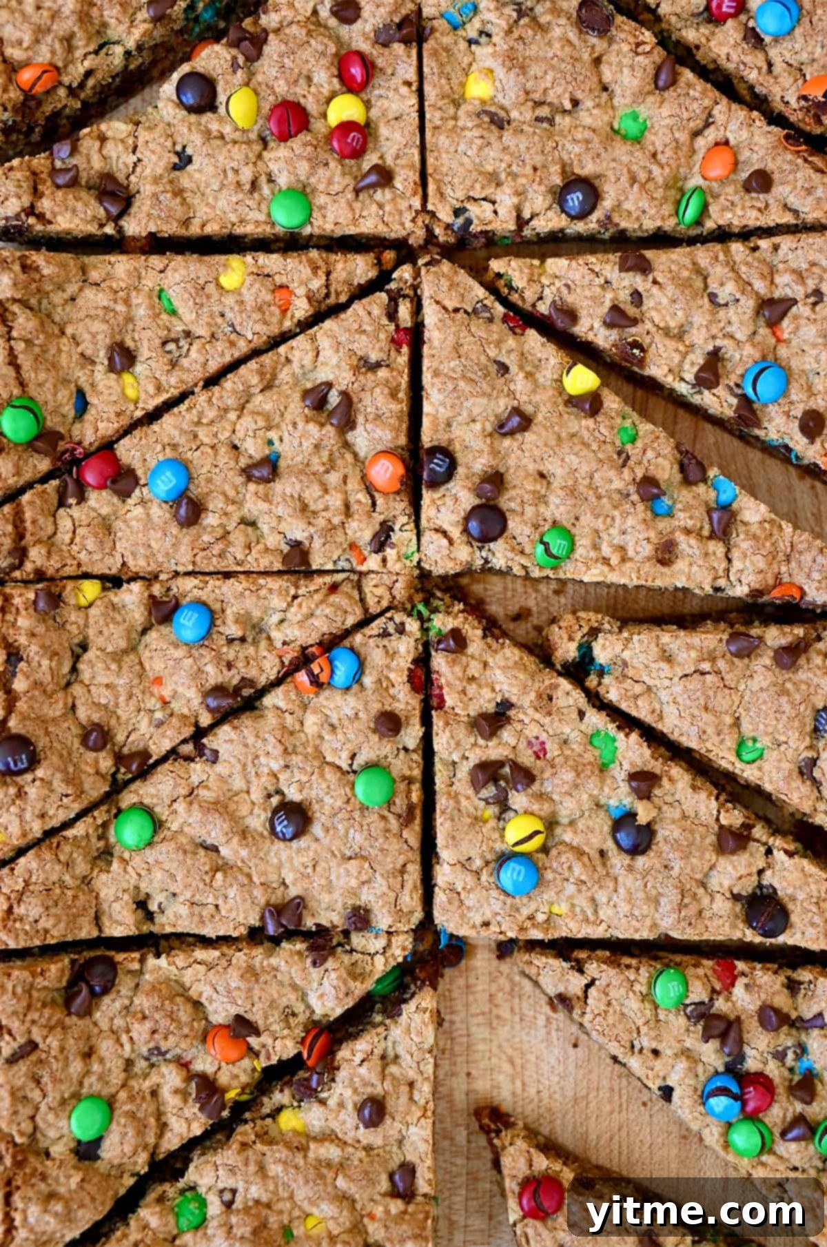Peanut butter oatmeal bars with M&Ms and chocolate chips, showcasing their rich, inviting appearance.