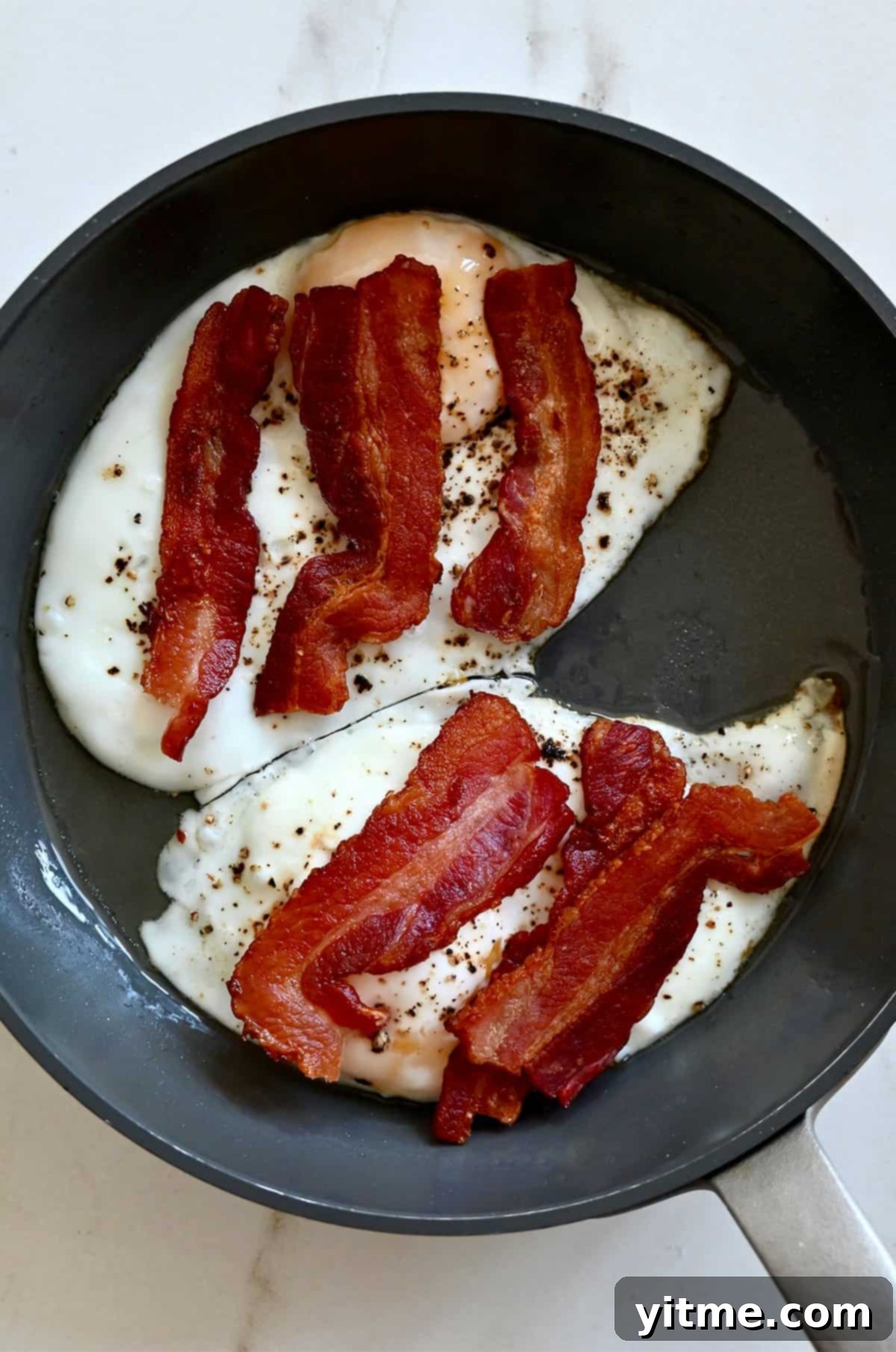 The Quintessential Egg Sandwich 4 Frying eggs and bacon for a breakfast sandwich