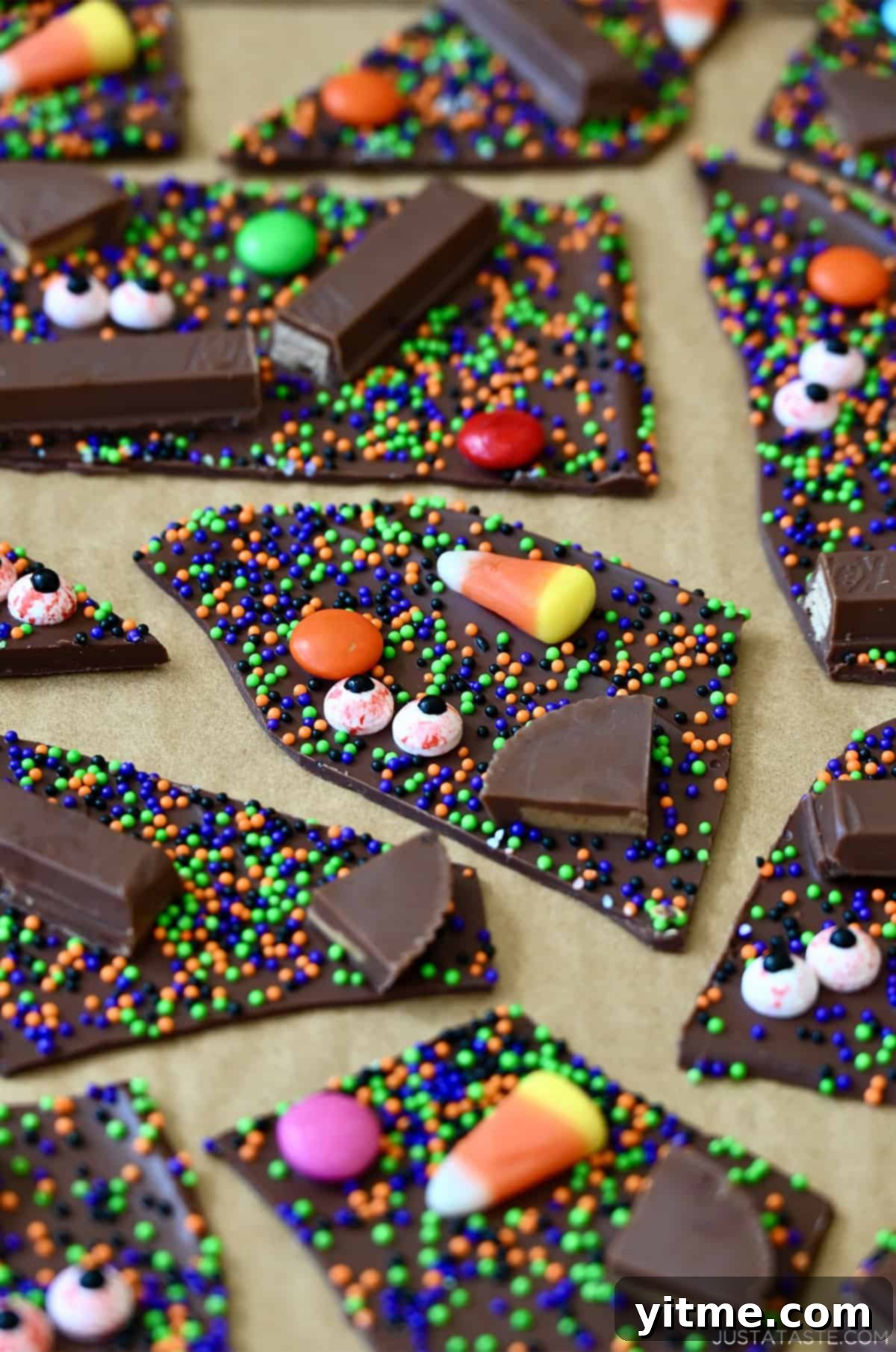 Cut Halloween candy bark on parchment paper.