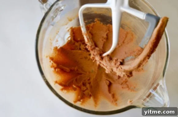 Butter, cinnamon and sugar in a glass mixing bowl