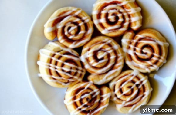 Rolls arranged on a white plate and topped with icing