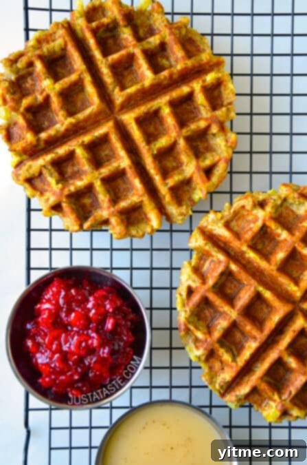 Delicious crispy leftover stuffing waffles topped with cranberry sauce and gravy.