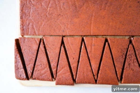 A baked tray of brownies sliced into wedges