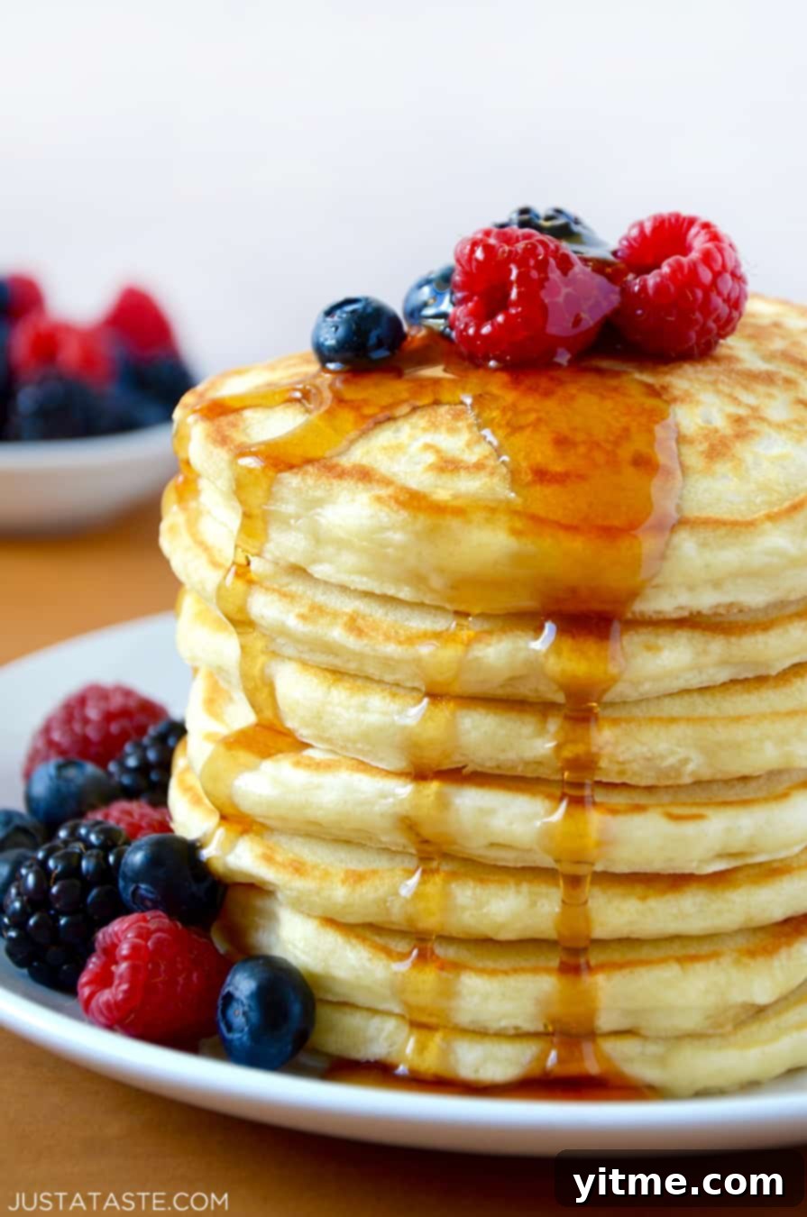 A stack of Greek Yogurt Pancakes topped with fruit