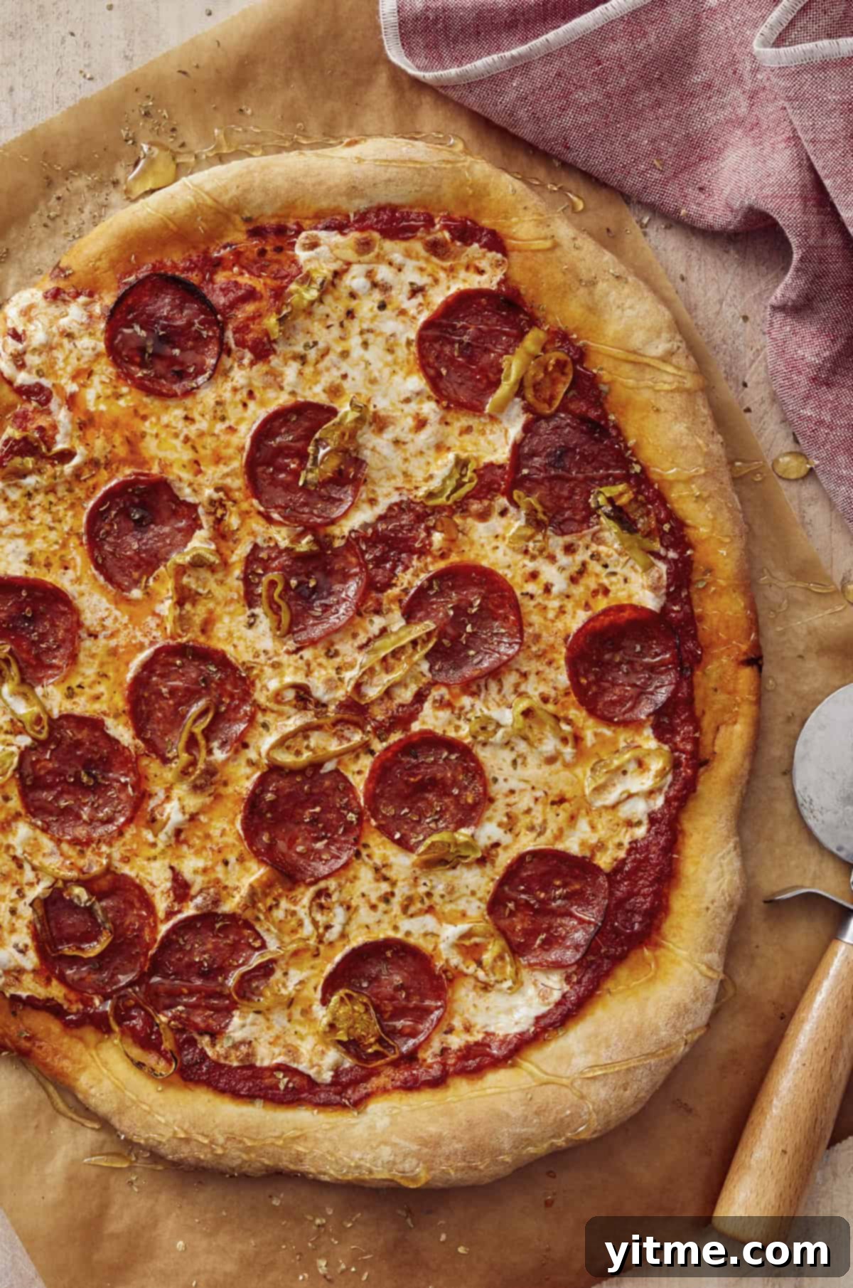 Delicious pepperoni pizza with banana peppers and hot honey drizzle