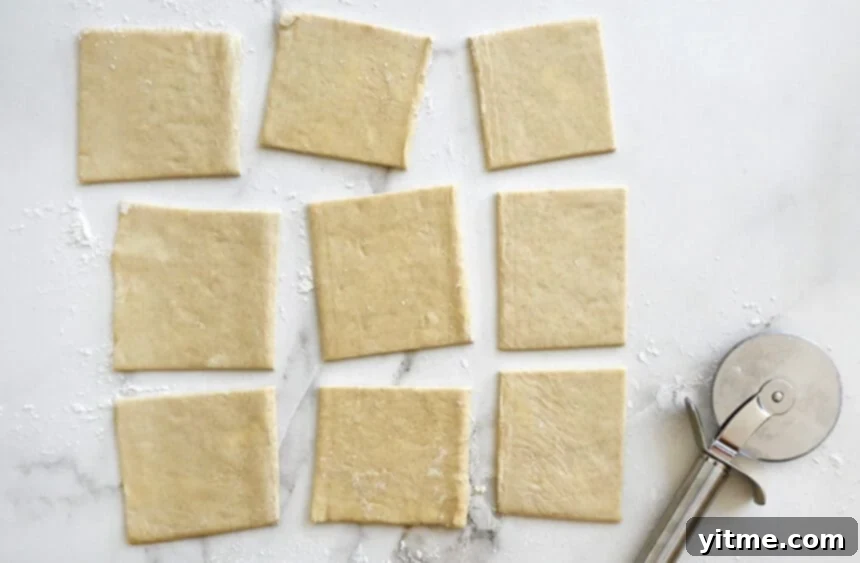 Puff pastry squares being cut