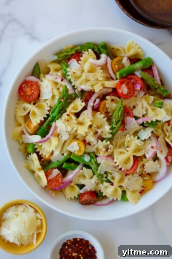 Asparagus Pasta Salad with Zesty Italian Vinaigrette 6 Large white bowl containing Asparagus Pasta Salad with Italian Dressing