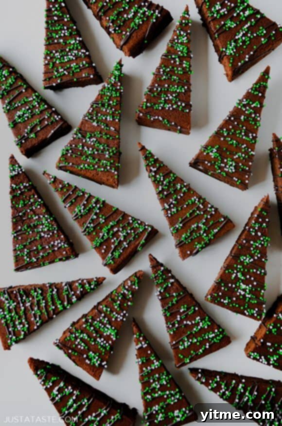 A view of Christmas Brownies drizzled with chocolate and topped with sprinkles