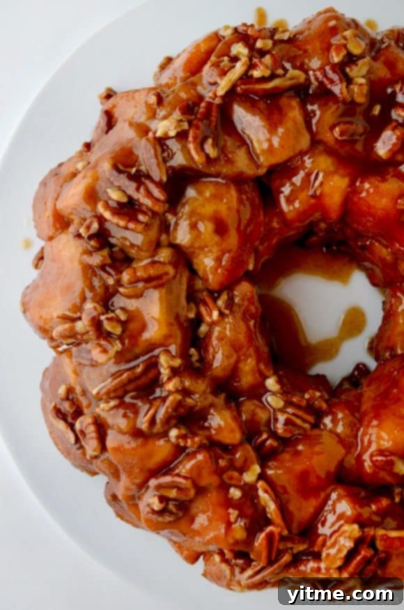 Easy Pecan Monkey Bread served on a white plate.