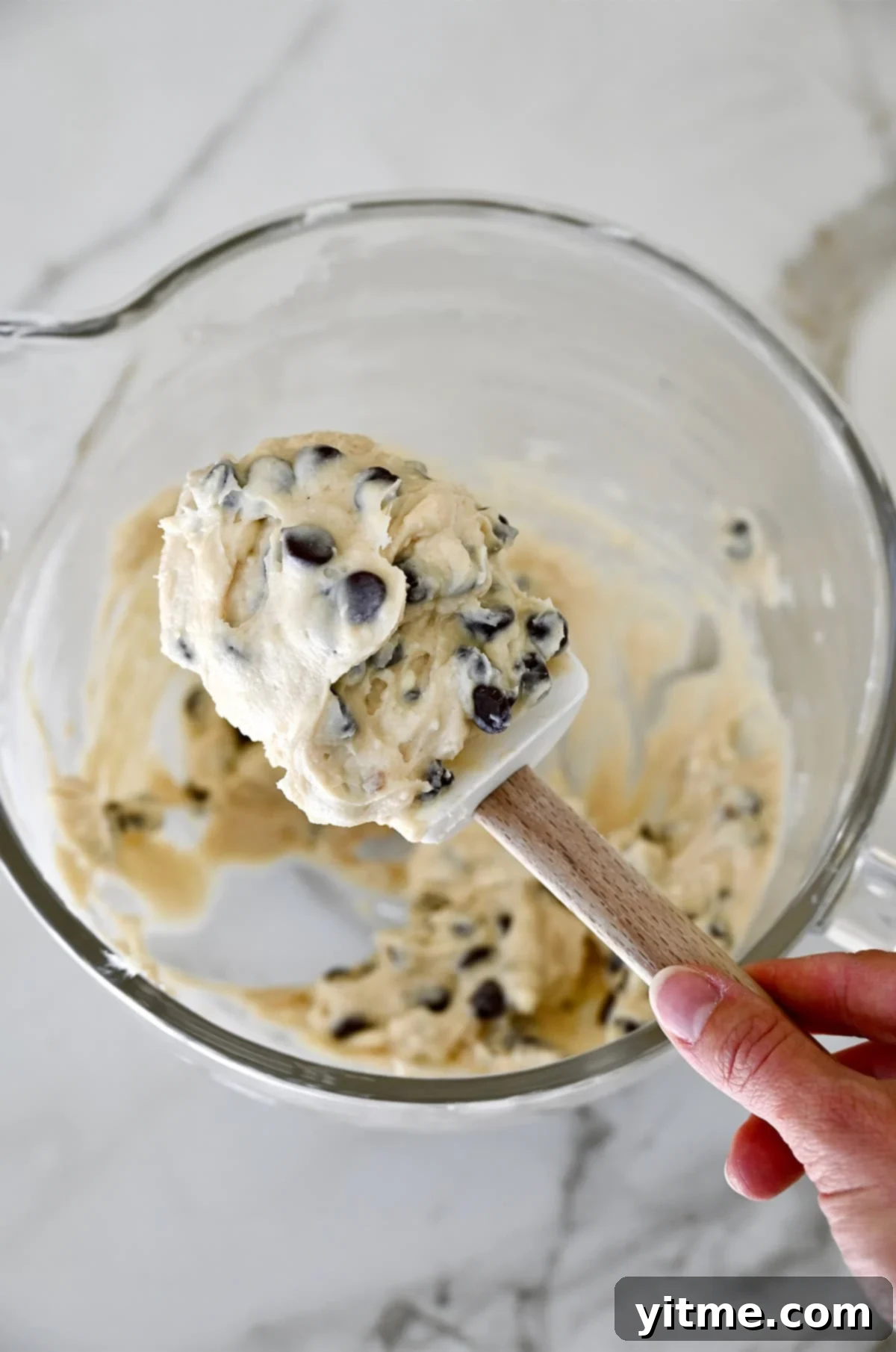 Chocolate Chip Cookie Dough Delight 5 A spatula covered in cookie dough dip with chocolate chips.