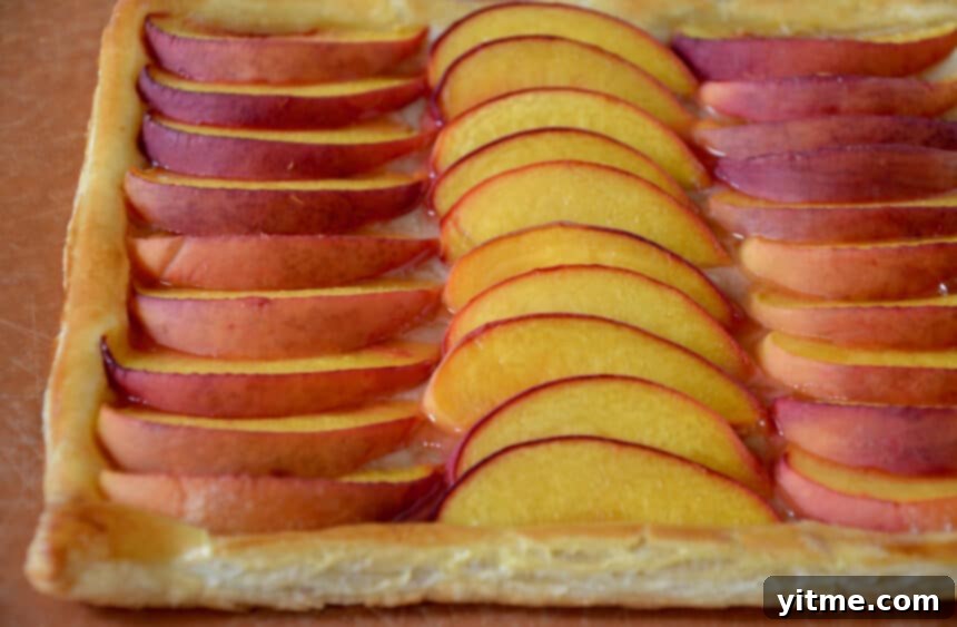 Golden brown 5-Ingredient Peach Tart with perfectly baked peaches.