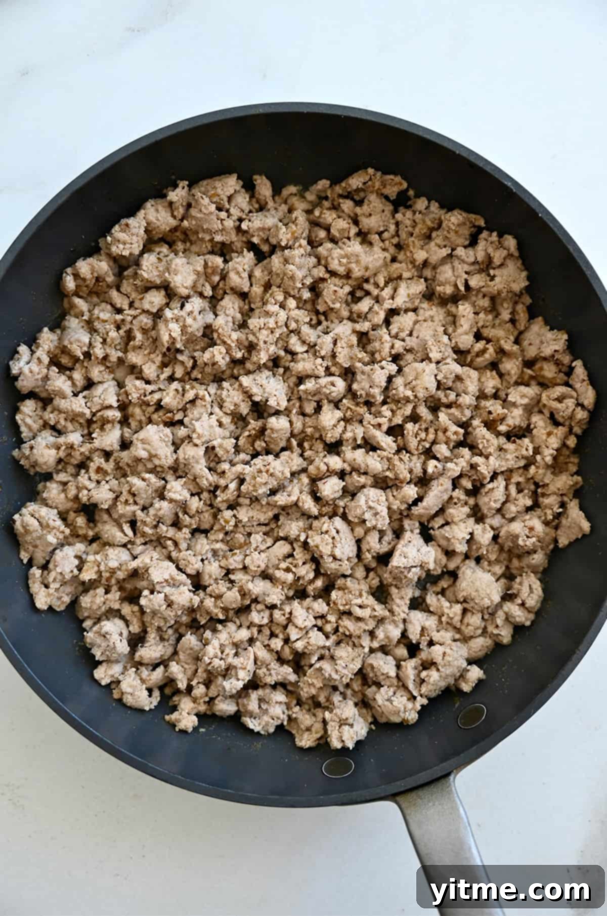 Cooked taco meat in a skillet.