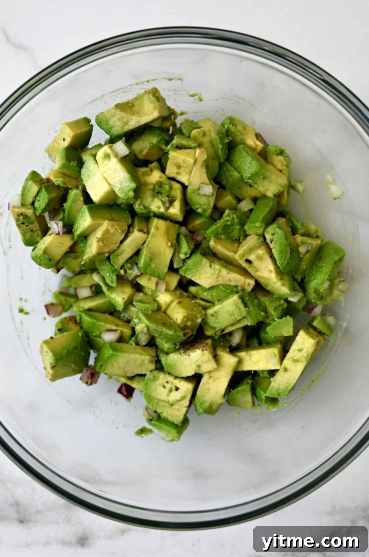 Avocado egg roll filling in a glass bowl.