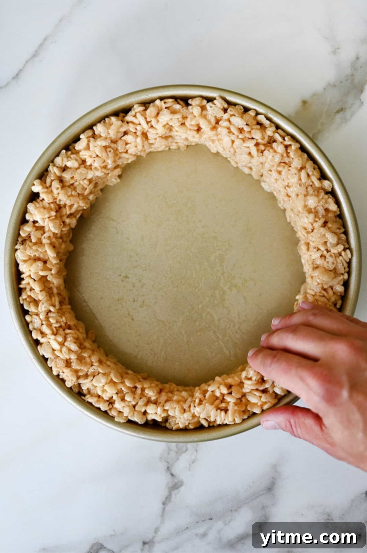 Pumpkin Spice Rice Krispies Delights 4 Molding vanilla marshmallow treats around the edge of a cake pan to create a 'crust'.
