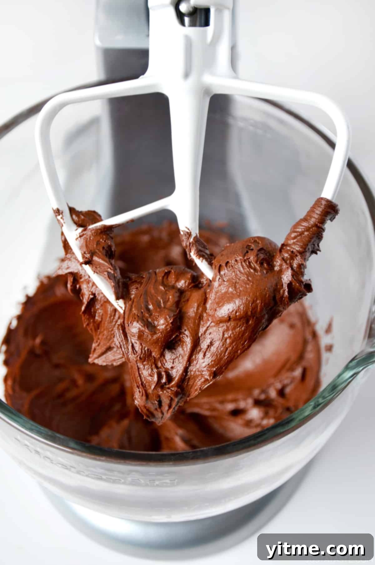 Chocolate buttercream frosting on a stand mixer