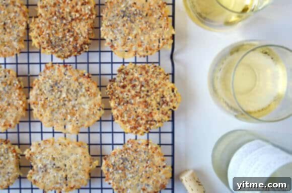 Several Everything Parmesan Cheese Crisps stacked together on a serving dish.